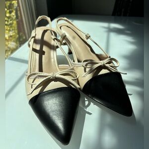 Elegant black and white kitten heels